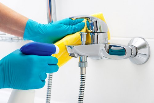Technician using hot water extraction for carpet cleaning